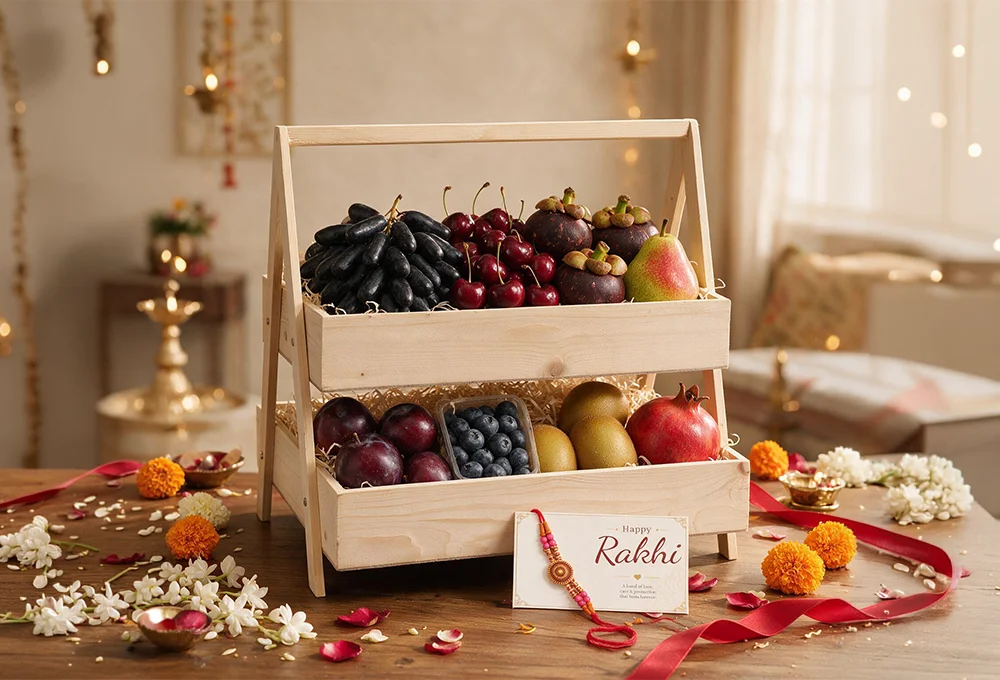 Moon Drop Grapes, Canadian Cherries, Mangosteen, Red Beauty Pear, Fresh Red Plums, Blueberries, Fresh Golden Kiwi, Pomegranate with Decorative Rakhi & Raksha Bandhan Greeting Card in a Premium Two-Tier Wooden Tray