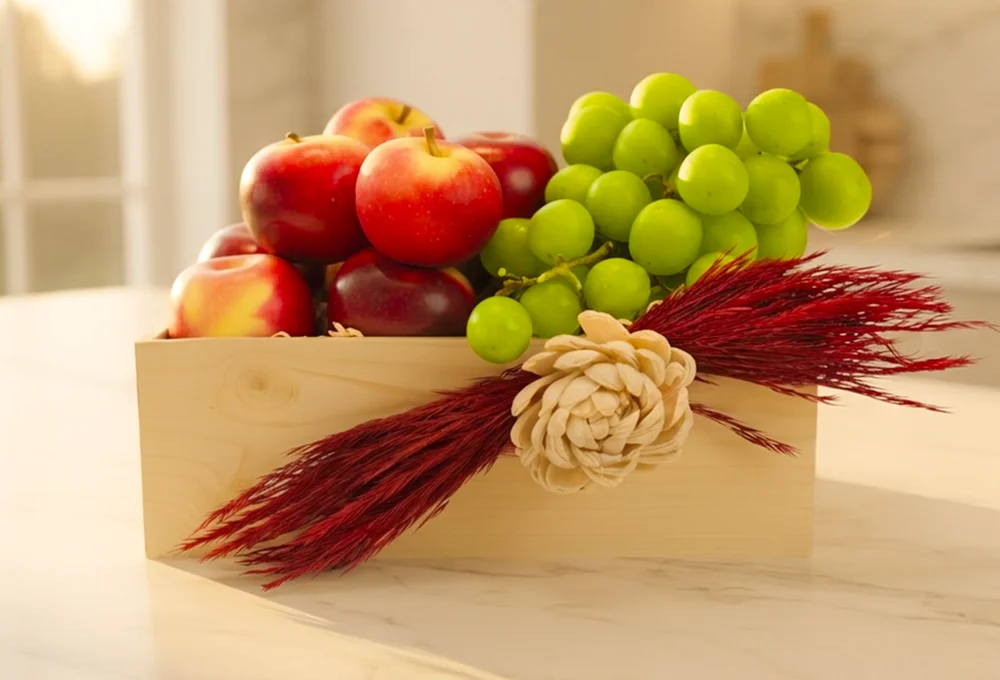 500 Gms of rockit apples and 500 gms of green muscut grapes in a wooden tray