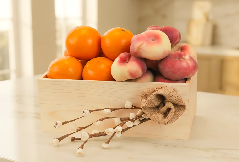 500 Gms of Mandrian Orange and 500 gms of Donut Peach in a wooden tray