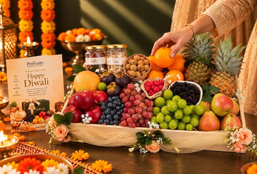 Rockit Apple, Grapefruit, Mangosteen, Longan, Blueberries, Red Seedless Grapes, Valencia Orange, Whole Honey Pineapple, Red Beauty Pear, Mulberries, Raspberries, Green Muscat Grapes, Cashew Jar, and Fig Jar with a Wooden Tray & Happy Diwali Greeting Card.