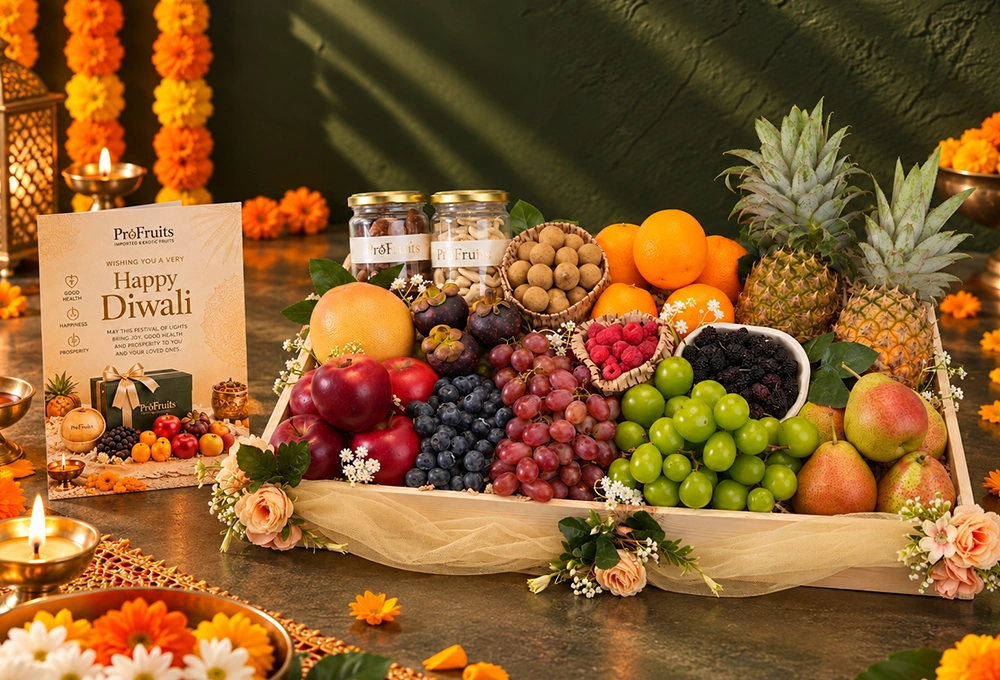 Rockit Apple, Grapefruit, Mangosteen, Longan, Blueberries, Red Seedless Grapes, Valencia Orange, Whole Honey Pineapple, Red Beauty Pear, Mulberries, Raspberries, Green Muscat Grapes, Cashew Jar, and Fig Jar with a Wooden Tray & Happy Diwali Greeting Card.