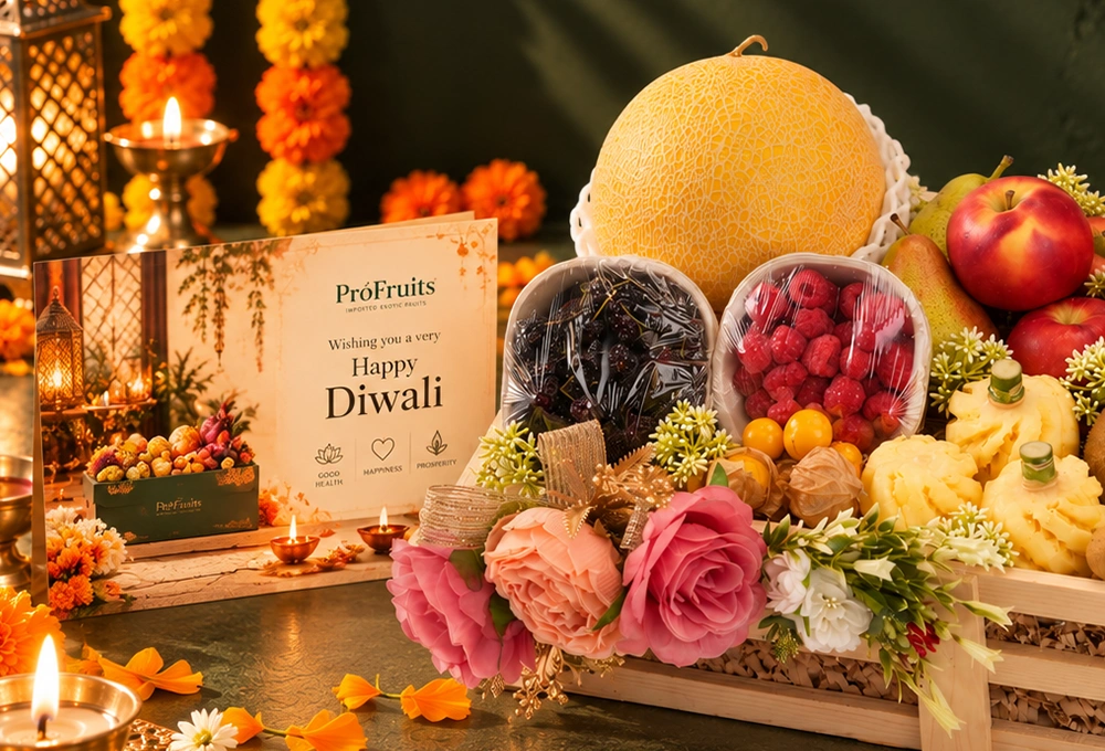 Golden Kiwi, Golden Emerald Muskmelon, Red Beauty Pear, Rockit Apple, Kutch Dragon Fruit, Murcott Orange, Longan, Honey Pineapple, Gooseberry, Mulberry, and Raspberry with a Wooden Tray & Happy Diwali Greeting Card.