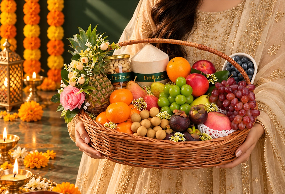 Longan, Mangosteen, Murcott Orange, Red Beauty Pear, Green Vermont Pear, Valencia Orange, Rockit Apple, Green Muscat Grapes, Red Seedless Grapes, Fuji Apple, Thai Coconut, Whole Honey Pineapple, and Blueberries with a Handle Basket & Happy Diwali Greeting Card.