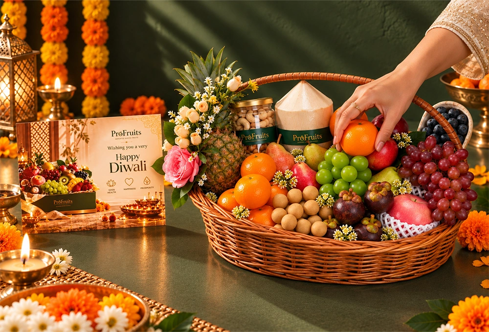 Longan, Mangosteen, Murcott Orange, Red Beauty Pear, Green Vermont Pear, Valencia Orange, Rockit Apple, Green Muscat Grapes, Red Seedless Grapes, Fuji Apple, Thai Coconut, Whole Honey Pineapple, and Blueberries with a Handle Basket & Happy Diwali Greeting Card.