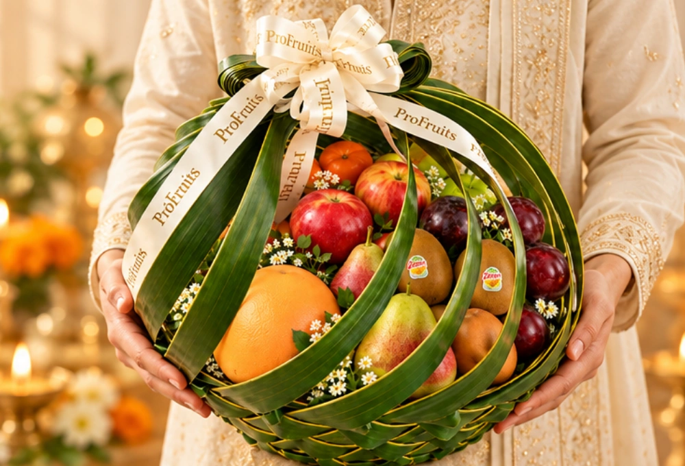 Premium Diwali fruit gift featuring Red Beauty Pears, Golden Kiwi, China Plums, Green and Rockit Apples, Mandarins, Kutch Dragon Fruit, Grapefruit and a greeting card